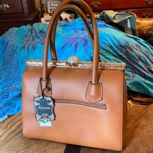 purse with gold metal and a bling closure